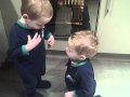 Another set of Twins conversing and imitating each other